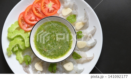 shrimp in fish sauce with Thai spicy seafood dipping sauce on white plate shrimp in fish sauce with Thai spicy seafood dipping sauce on white plate 141092177