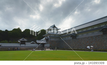 Kanazawa, Japan - Oct 6 2024, panoramic view of Kanazawa Palace courtyard, with people walking along the fortress walls in background, with an overcast sky, at daytime, Kanazawa, Japan Kanazawa, Japan - Oct 6 2024, panoramic view of Kanazawa Palace courtyard, with people walking along the fortress walls in background, with an overcast sky, at daytime, Kanazawa, Japan 141093309