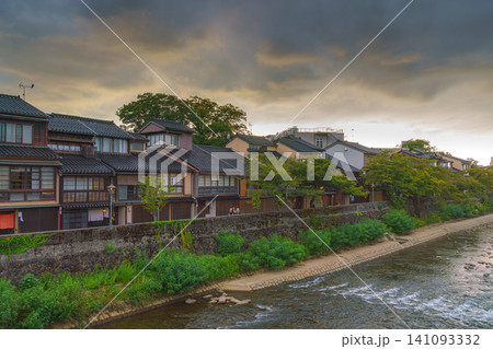 Kanazawa, Japan - Oct 6 2024, panoramic view of the Asano River bank, lined with the ancient wooden teahouses of the Higashi Chaya district, in cloudy weather, at daytime, Kanazawa, Japan 141093332