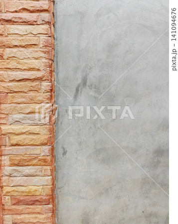 Modern loft concrete wall background with orange sandstone brick border. Modern loft concrete wall background with orange sandstone brick border. 141094676
