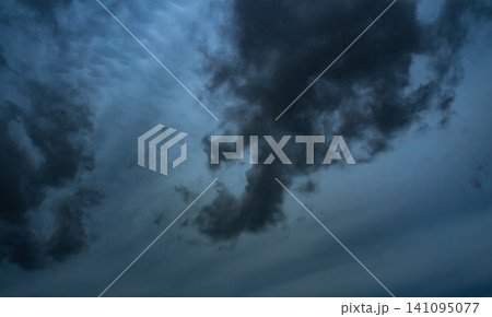 Cloud storm sky dark rain lightning thunder stoumy typhoon Nature light scene rainy atmosphere damage effect carbon dioxide dust air pollution 2.5 Pm, texture nature windstorm weather skyscape. 141095077