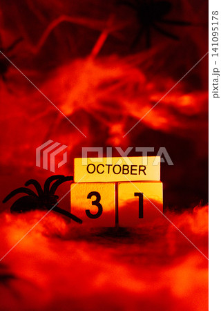 Atmospheric Halloween concept symbolizing arrival of October 31, combining seasonal decoration dramatic lighting and festive tradition 141095178