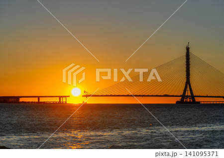 Sunset over the Danjiang Bridge construction in Tamsui, Taiwan Sunset over the Danjiang Bridge construction in Tamsui, Taiwan 141095371