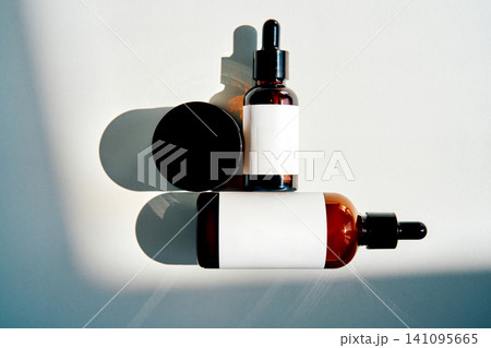 Skincare product packaging with amber dropper bottle and jar Skincare product packaging with amber dropper bottle and jar 141095665