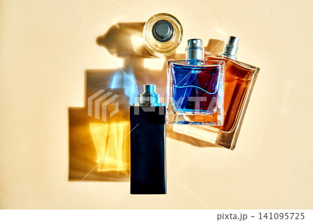 Perfume bottles creating colorful shadows on surface Perfume bottles creating colorful shadows on surface 141095725