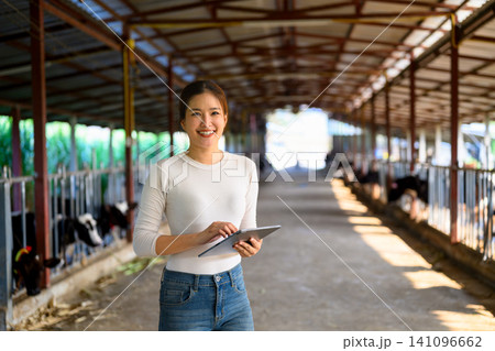 Portrait woman farmer on dairy farm 141096662