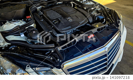 Mercedes V6 Engine Bay Under Open Hood Showing Car Motor Components and all engine mechanical Mercedes V6 Engine Bay Under Open Hood Showing Car Motor Components and all engine mechanical 141097218