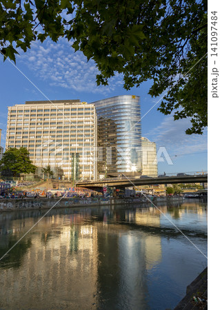 Vienna, Austria - June 13, 2023: Multi-storey buildings on the Danube Canal embankment in Vienna Vienna, Austria - June 13, 2023: Multi-storey buildings on the Danube Canal embankment in Vienna 141097484