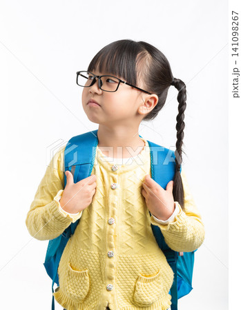 Asian schoolgirl with backpack showing negative emotions, sad upset thinking crying child isolated on white background, education stress concept Asian schoolgirl with backpack showing negative emotions, sad upset thinking crying child isolated on white background, education stress concept 141098267
