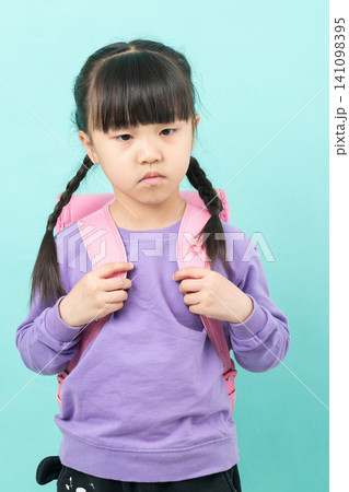 Sad and discouraged little girl looking down in shame or sorrow, childhood depression and loneliness concept. 141098395