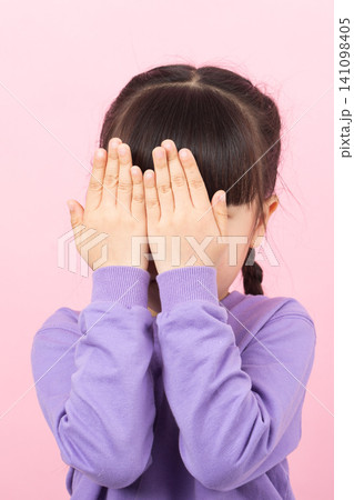 Sad Asian girl rubbing eyes crying child upset emotion concept Sad Asian girl rubbing eyes crying child upset emotion concept 141098405