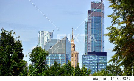 Building surrounded with green trees. Eco-friendly building. Sustainable architecture of city reducing heat carbon dioxide modern city environment. Building surrounded with green trees. Eco-friendly building. Sustainable architecture of city reducing heat carbon dioxide modern city environment. 141099027