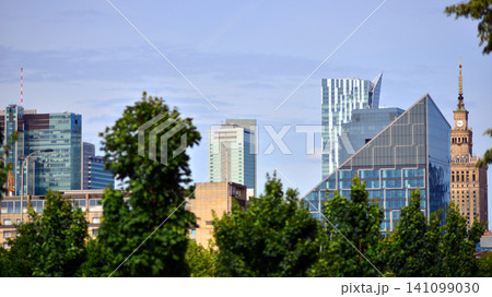 Building surrounded with green trees. Eco-friendly building. Sustainable architecture of city reducing heat carbon dioxide modern city environment. Building surrounded with green trees. Eco-friendly building. Sustainable architecture of city reducing heat carbon dioxide modern city environment. 141099030