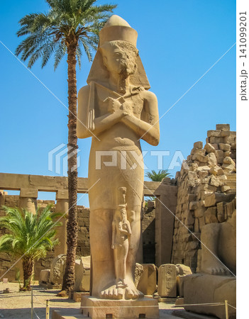 Pharaoh statue in anscient Temple of Karnak in Luxor - Ruined Thebes Egypt Pharaoh statue in anscient Temple of Karnak in Luxor - Ruined Thebes Egypt 141099201