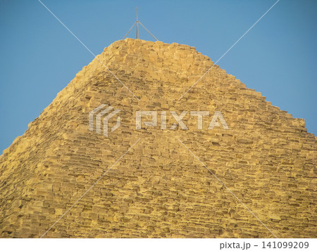 Top of the Great Pyramid of Giza also known as the Pyramid of Khufu or the Pyramid of Cheops. Giza pyramids, Egypt. Cairo - Giza. View of pyramids from the Giza Plat 141099209