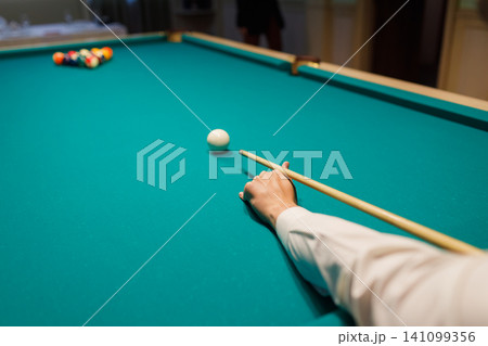 Billiard player play snooker on pool table. Billiard player play snooker on pool table. 141099356