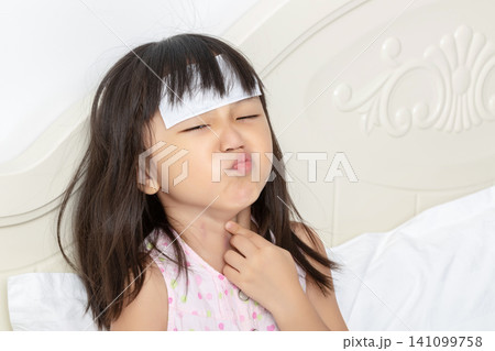 Asian Little Girl with Sore Throat and Fever Feeling Pain 141099758