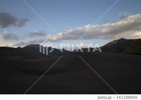 Mountain Desert Landscape with Dramatic Clouds at Dusk Mountain Desert Landscape with Dramatic Clouds at Dusk 141100056