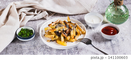 Delicious French fries with mushrooms on a plate on the table web banner Delicious French fries with mushrooms on a plate on the table web banner 141100603