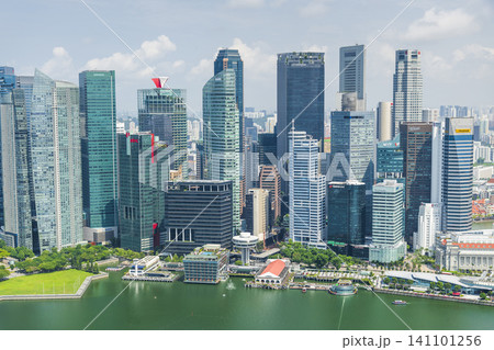 Building view of modern skyscrapers along Marina Bay in the Raffles Place financial district from the Marina Bay Sands Skypark, Singapore. 141101256