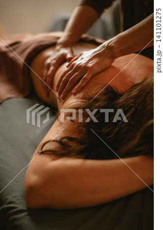 Back massage with hands close-up Back massage with hands close-up 141101275