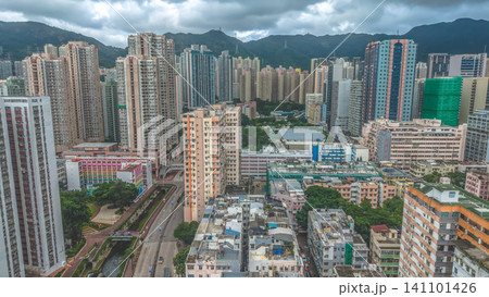 Hong Kong. July 5 2026 San Po Kong Skyline Beneath Dramatic Mountain Hong Kong. July 5 2026 San Po Kong Skyline Beneath Dramatic Mountain 141101426