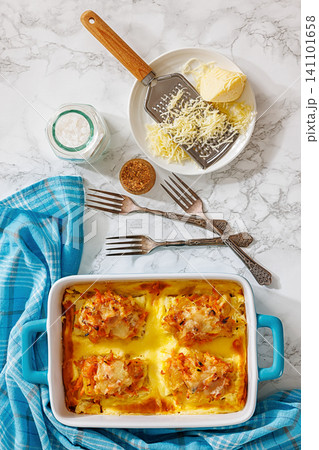 Cheesy Veggie Baked White Fish in blue baking dish 141101658