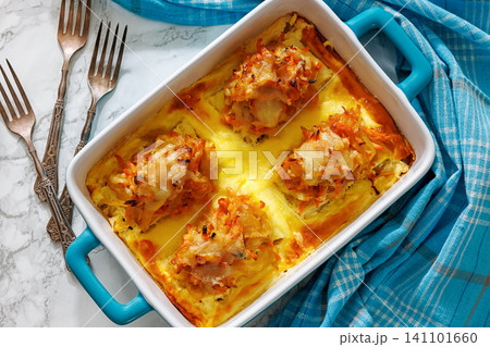 Cheesy Veggie Baked White Fish in blue baking dish Cheesy Veggie Baked White Fish in blue baking dish 141101660