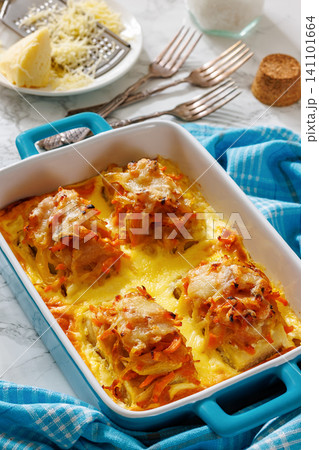 Cheesy Veggie Baked White Fish in blue baking dish Cheesy Veggie Baked White Fish in blue baking dish 141101664