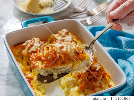 Cheesy Veggie Baked White Fish in blue baking dish 141101665