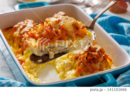 Cheesy Veggie Baked White Fish in blue baking dish Cheesy Veggie Baked White Fish in blue baking dish 141101666
