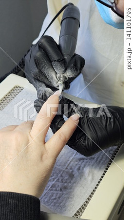 Natural nail recovery after damaged gel polish removal in professional manicure salon. renews weakened nails for healthy natural beauty. 141101795