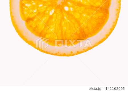 A single fresh orange slice isolated on a white background. A single fresh orange slice isolated on a white background. 141102095