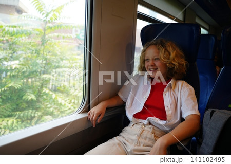 Joyful Child Smiling on Train Ride Joyful Child Smiling on Train Ride 141102495