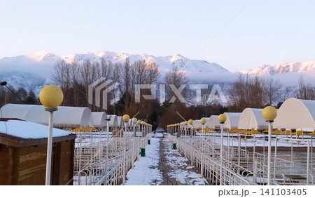 The pier on Lake Issyk-Kul against the background of mountains The pier on Lake Issyk-Kul against the background of mountains 141103405