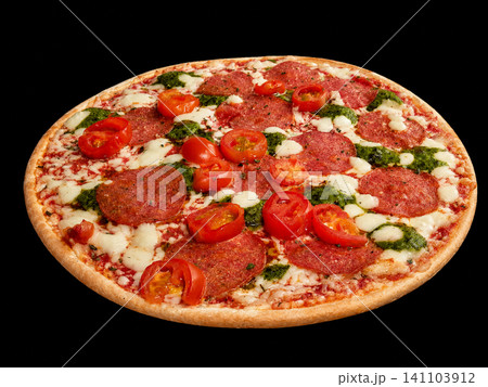 Pepperoni Pizza with Cherry Tomatoes, Mozzarella and Pesto Isolated on Black Background Pepperoni Pizza with Cherry Tomatoes, Mozzarella and Pesto Isolated on Black Background 141103912