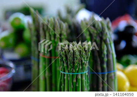 asparagus at market. Asparagus. Fresh bundles green asparagus on market place. asparagus at market. Asparagus. Fresh bundles green asparagus on market place. 141104050