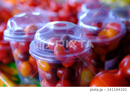 red cherry tomatoes at market. vibrant cluster of ripe, red cherry tomatoes red cherry tomatoes at market. vibrant cluster of ripe, red cherry tomatoes 141104102