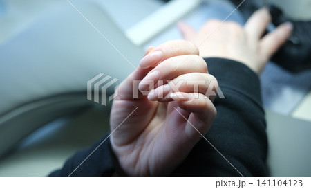 Natural nail recovery after damaged gel polish removal in professional manicure salon. renews weakened nails for healthy natural beauty. Natural nail recovery after damaged gel polish removal in professional manicure salon. renews weakened nails for healthy natural beauty. 141104123
