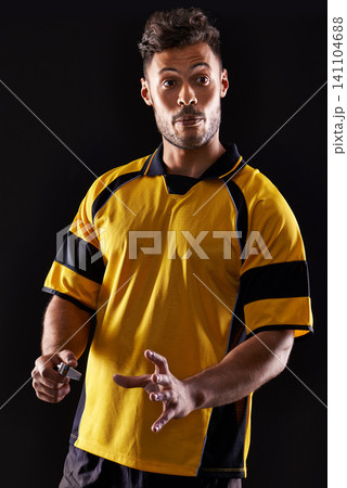 Face, referee or man with warning, foul call or penalty review in sports, rugby or football game at night. Soccer match, dark or person in studio with discipline, rules or caution on black background 141104688