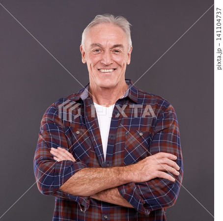 Senior, fashion and man in portrait with arms crossed, confidence or modern style on grey background. Proud person, casual model and happy mature guy in studio with smile, clothes or pride in England 141104737