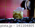 Young potatoes boiling in clear glass pot over gas flame with bubbling water creating traditional homemade cooking scene close up food video 141104805