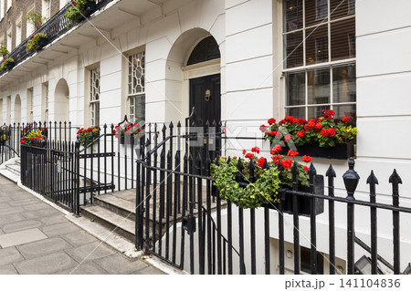 Classic London townhouse facade with white stucco walls Classic London townhouse facade with white stucco walls 141104836