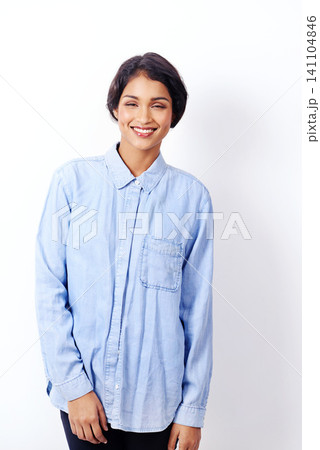 Indian woman, fashion and happy in studio for portrait with denim shirt for trendy outfit by white background. Isolated girl, person and model with smile for casual style in edgy clothes in Mumbai 141104846