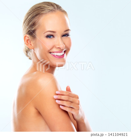 Studio, skincare and portrait of woman with smile for collagen treatment, dermatology or facial glow. Female person, happy and confidence with self care, healthy skin or wellness on blue background 141104921