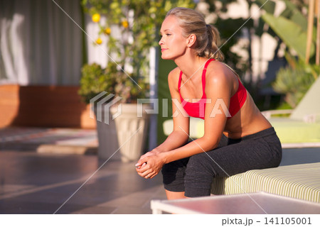 Woman, thinking and exercise outdoor on patio for health, wellness and memory in sportswear for workout at home. Relax, reflection for training or fitness with fresh air, sun and challenge with sport Woman, thinking and exercise outdoor on patio for health, wellness and memory in sportswear for workout at home. Relax, reflection for training or fitness with fresh air, sun and challenge with sport 141105001