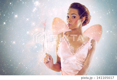 Woman, fairy and magic with glitter in studio portrait for wand, shine and pride with stars on background. Person, model or girl for fantasy, costume and butterfly wings for story, art and creativity Woman, fairy and magic with glitter in studio portrait for wand, shine and pride with stars on background. Person, model or girl for fantasy, costume and butterfly wings for story, art and creativity 141105017
