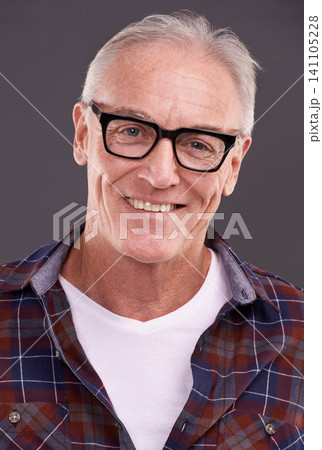 Mature man, fashion and glasses with smile in studio on background for eyewear, optometry and satisfied. Portrait, happy and style or casual outfit with positivity for retirement and enjoy with laugh Mature man, fashion and glasses with smile in studio on background for eyewear, optometry and satisfied. Portrait, happy and style or casual outfit with positivity for retirement and enjoy with laugh 141105228