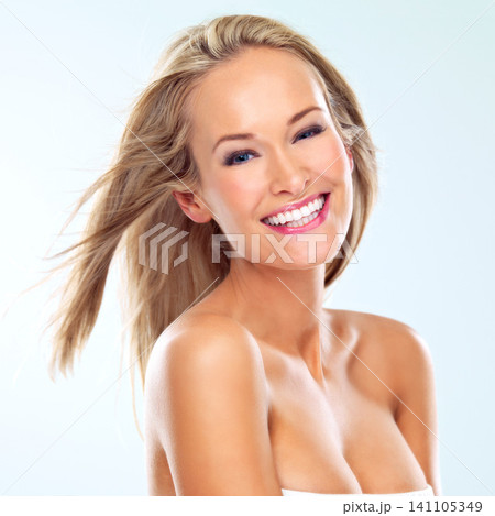 Woman, portrait and wind for happy hair in studio, smile and cosmetics for keratin treatment on white background. Person, conditioner and breeze for dermatology or texture, confidence and shampoo Woman, portrait and wind for happy hair in studio, smile and cosmetics for keratin treatment on white background. Person, conditioner and breeze for dermatology or texture, confidence and shampoo 141105349