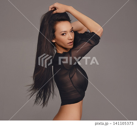 Portrait, makeup and woman in studio for beauty, wellness or glowing hair and glamour on grey background. Face, attitude and female model with dermatology, shine or smooth skin, results or aesthetic Portrait, makeup and woman in studio for beauty, wellness or glowing hair and glamour on grey background. Face, attitude and female model with dermatology, shine or smooth skin, results or aesthetic 141105373